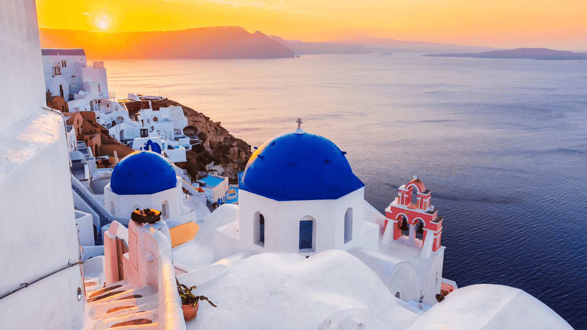 santorini at sunset sunrise greece blue stucco houses