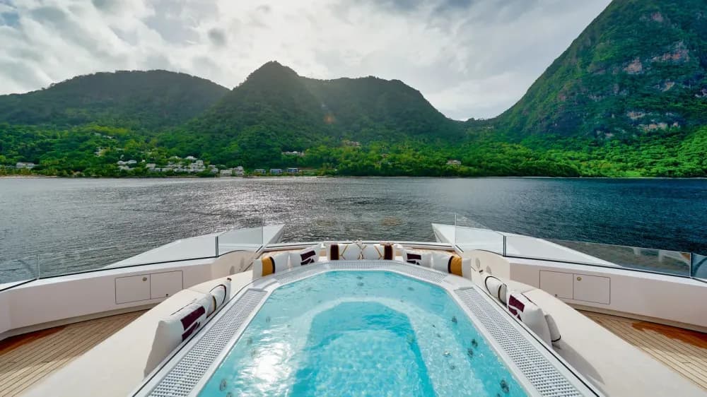 artefact jacuzzi on deck mountains in the distance
