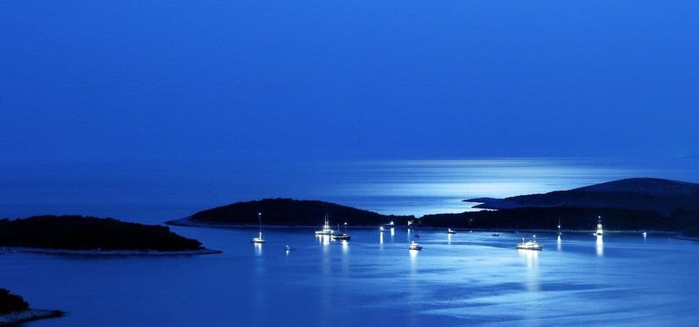 hvar sunset croatia blue boats at night