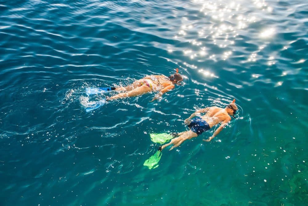 two people snorkelling in trogir croatia