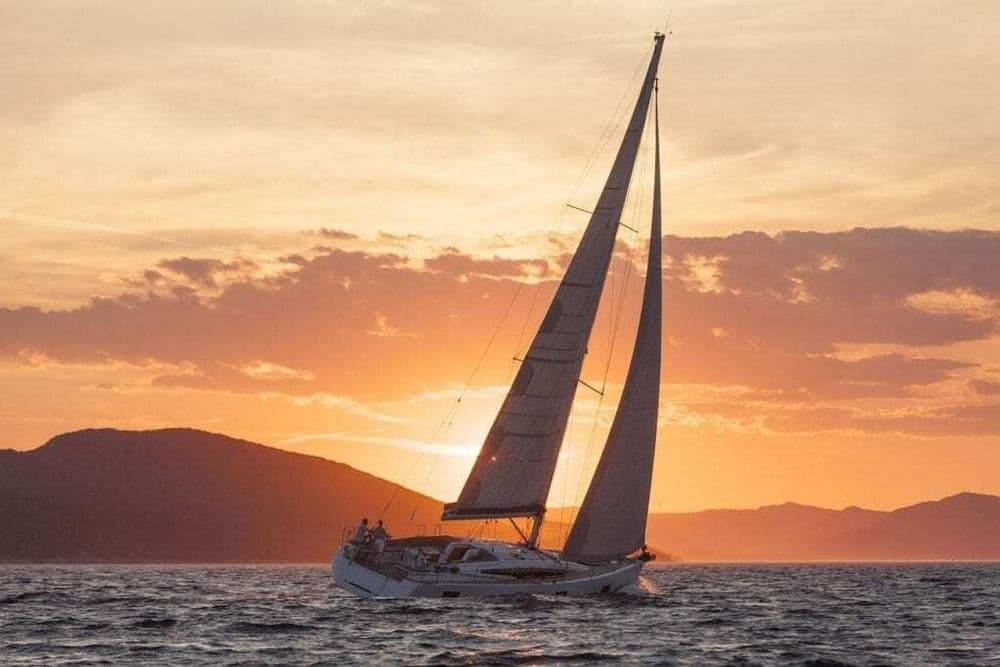 yacht at sunset sails up